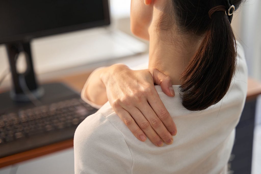 Women whose shoulders hurt from working from home